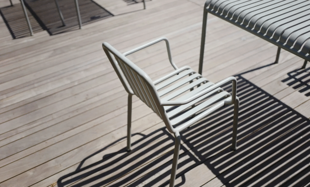 Deck Stain vs Paint: The Ultimate Homeowner’s Guide 1 In the deck stain vs paint debate, the weathered, natural look of this light wood deck suggests a semi-transparent stain was used.